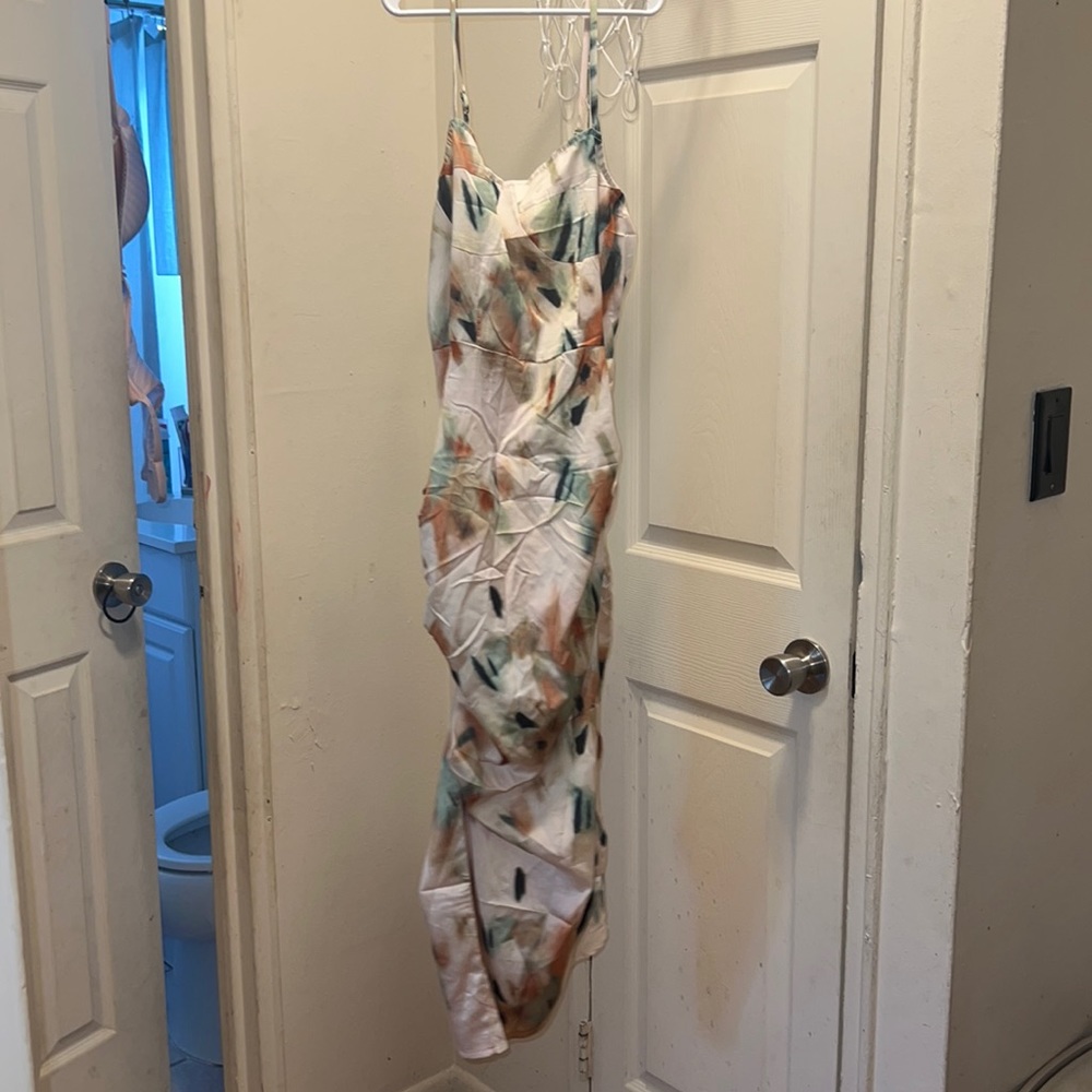 Medium size. Side slit dress summer dress. Dipper in back.